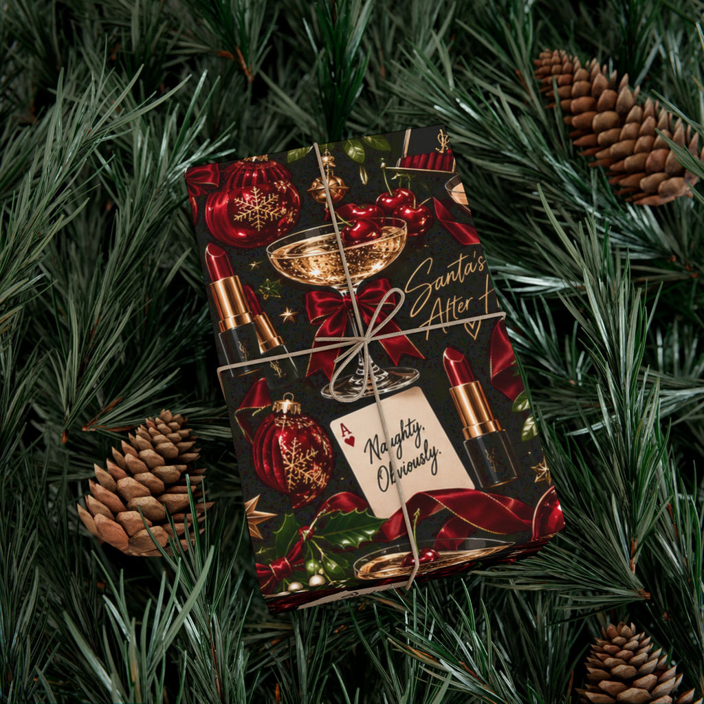 Santa's After Hours Christmas wrapping paper on a twine-tied gift, with red ribbons, gold ornaments, cocktails and playful holiday lettering